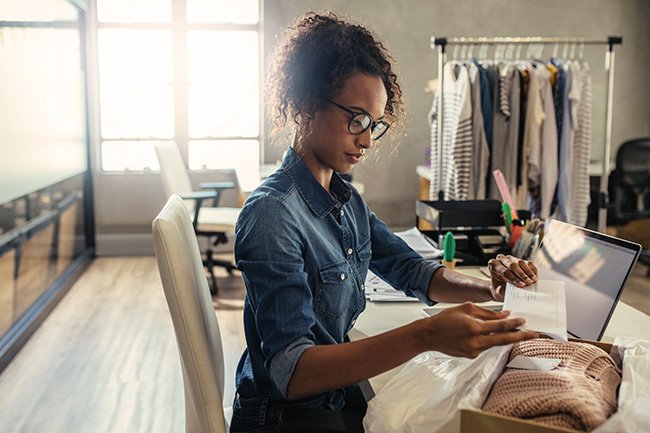 Female entrepreneur fulfilling an order from her e-commerce website.