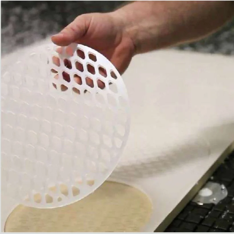 Phenolic grid tabletop for vacuum hold-down