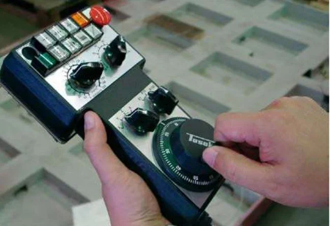 Handheld remote pendant with jog wheel