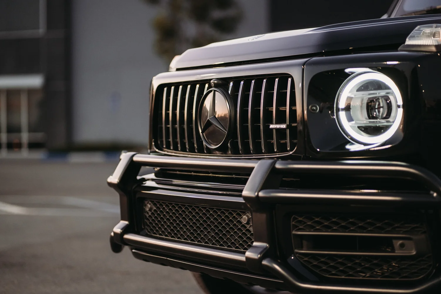 Mercedes-AMG G 63 after Paint Protection Film (PPF), Ceramic Coating, Chrome Delete and Wheel Powder Coating, low-angle front view