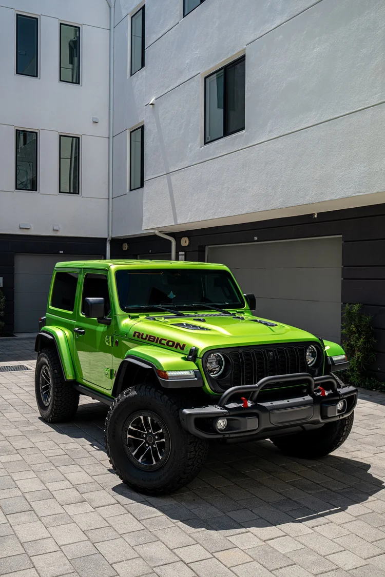 Front three-quarter view of the 2026 Jeep Wrangler Unlimited Rubicon in Mojito with gloss STEK DYNOshield PPF.