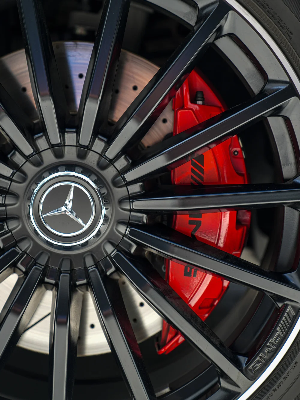 Mercedes-AMG GLS 63 wheel spokes and red brake caliper in a close-up