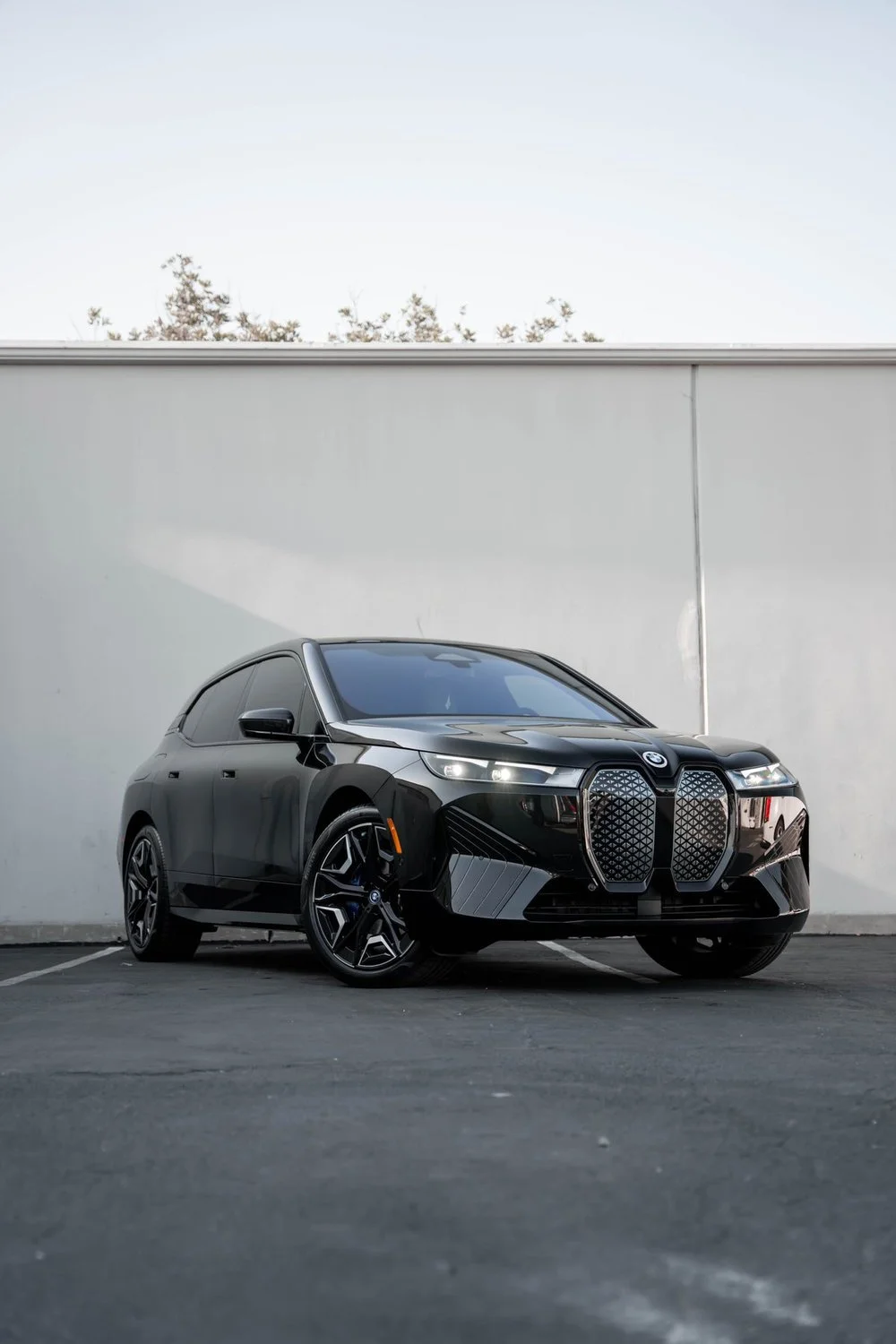 Black BMW iX Full-Body STEK DYNOshield PPF, XPEL XR Plus Window Tint & GYEON Ceramic Coating — Full-Body STEK DYNOshield PPF · XPEL XR Plus Window Tint · GYEON Ceramic Coating