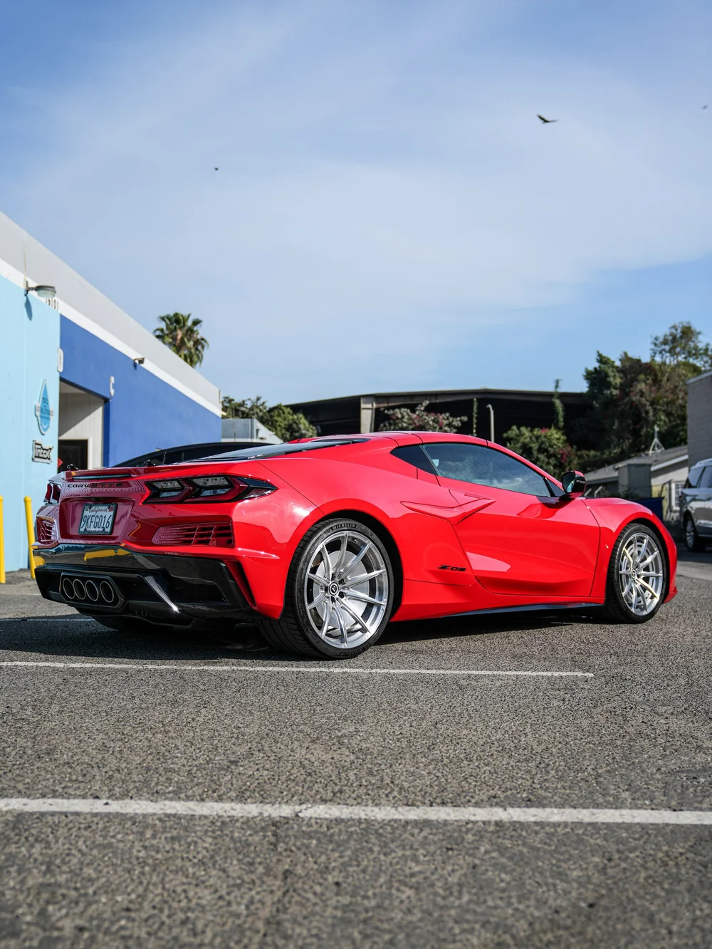 Full rear three-quarter view in the parking area — Chevrolet Corvette Z06 paint protection film project