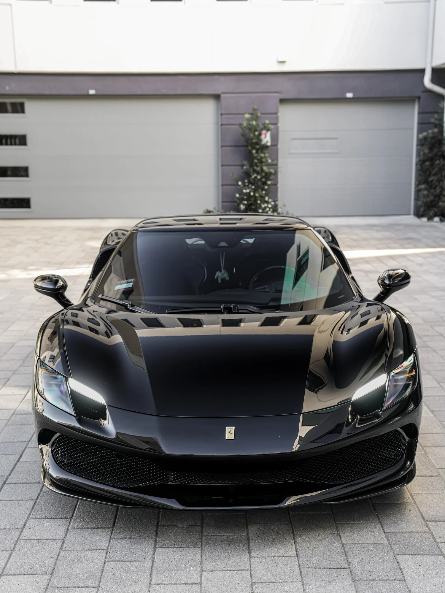 Ferrari 296 after Paint Protection Film (PPF) and Window Tint, low-angle front view