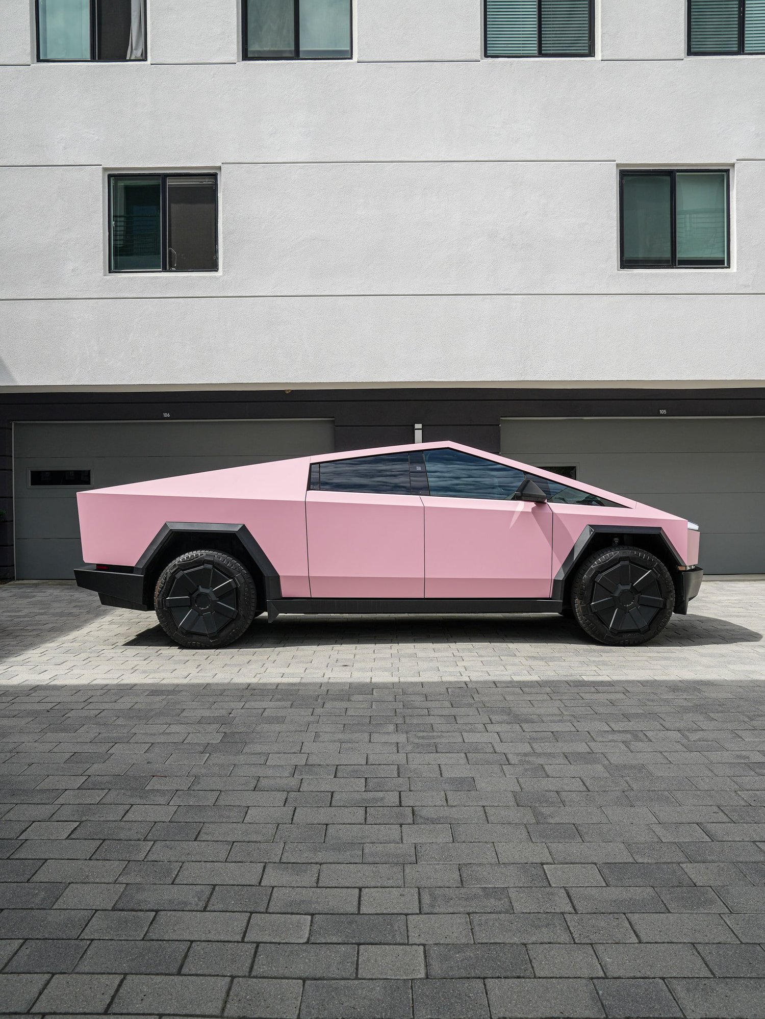 Satin Fresh Pink Tesla Cybertruck after Vinyl Wrap, left-side profile