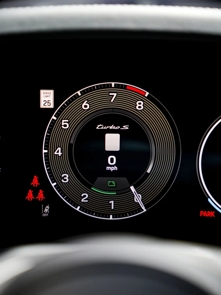 Turbo S lettering and tachometer graphics on the Porsche digital instrument display.