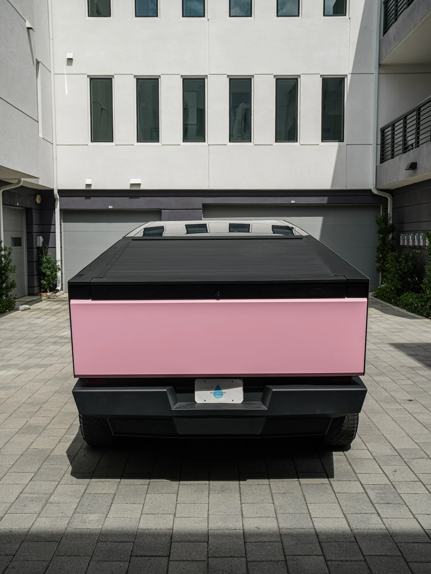 Satin Fresh Pink Tesla Cybertruck after Vinyl Wrap, direct rear view