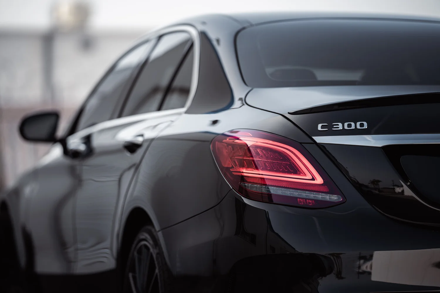 Mercedes-Benz C 300 after Window Tint, Ceramic Coating and Wheel Powder Coating, rear body and taillight view