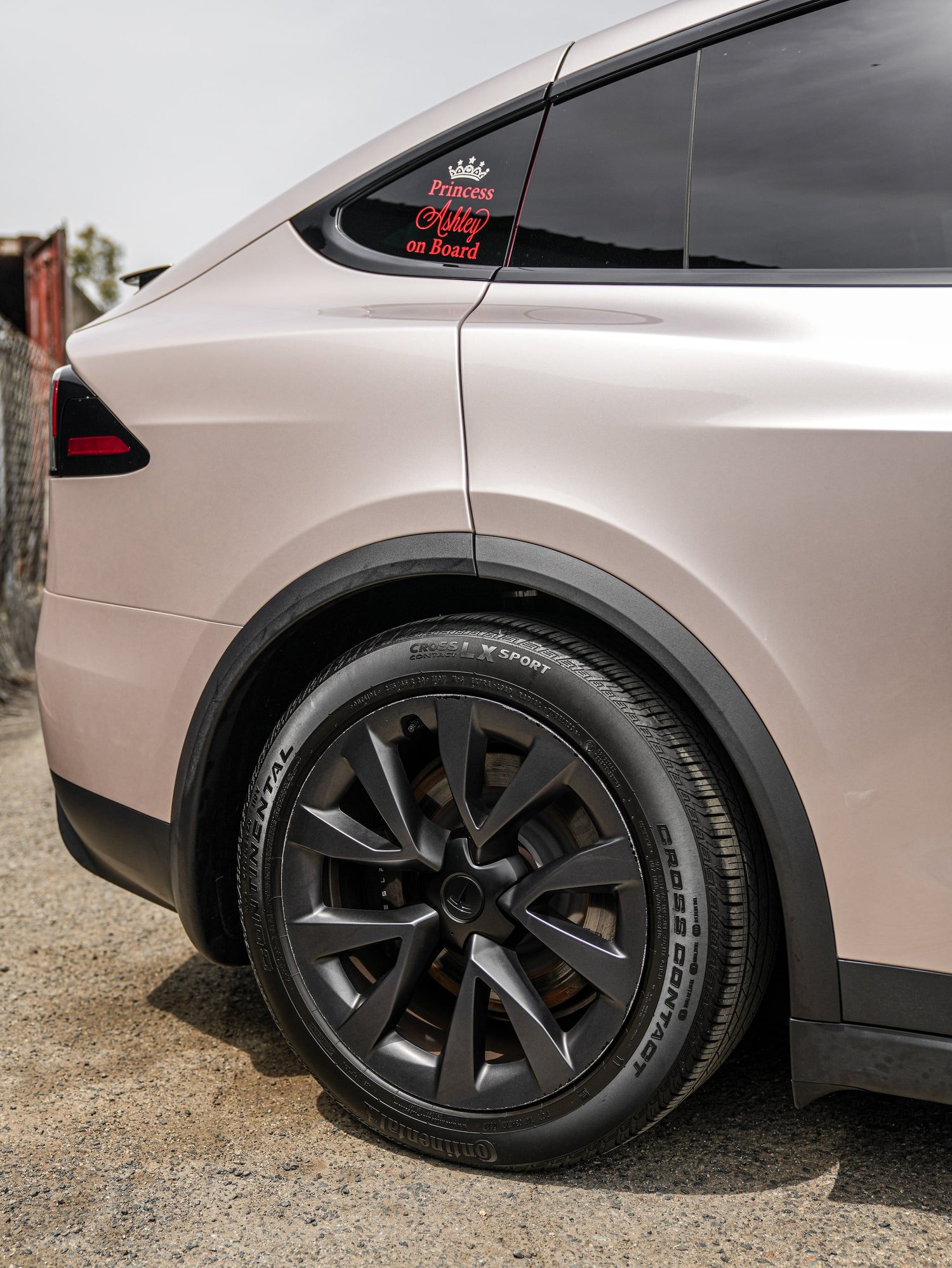 Tesla Model X Champagne Gold after Vinyl Wrap, rear-quarter and wheel view