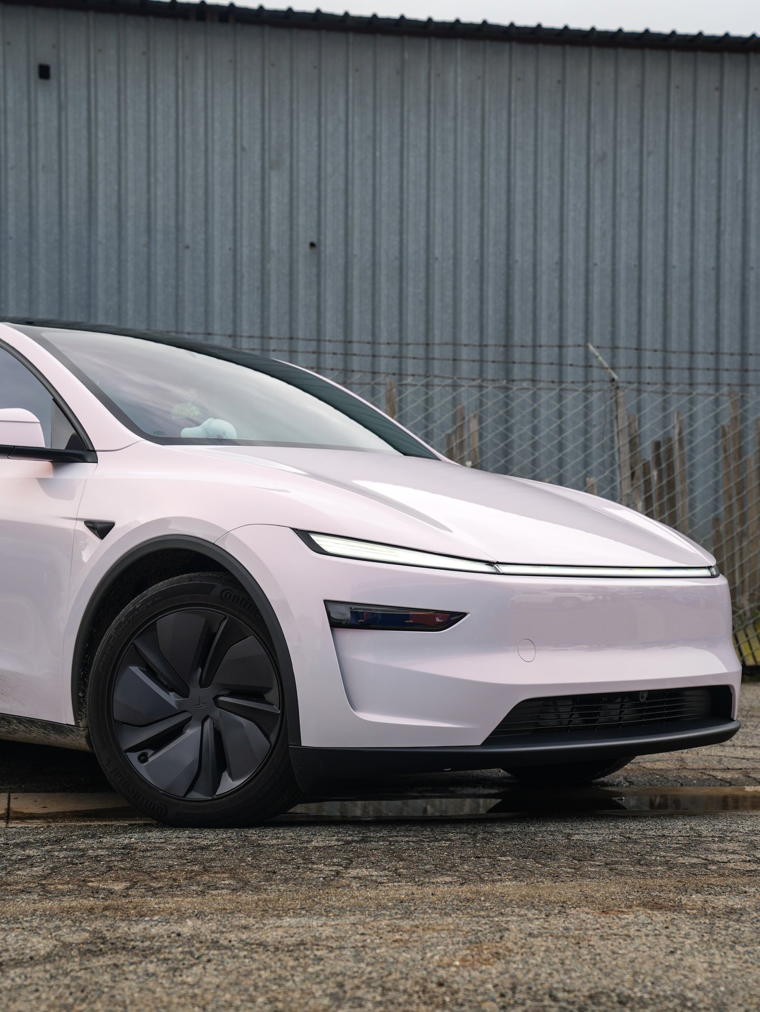 Pale Blush Pink Tesla Model Y after Vinyl Wrap, front wheel and body view