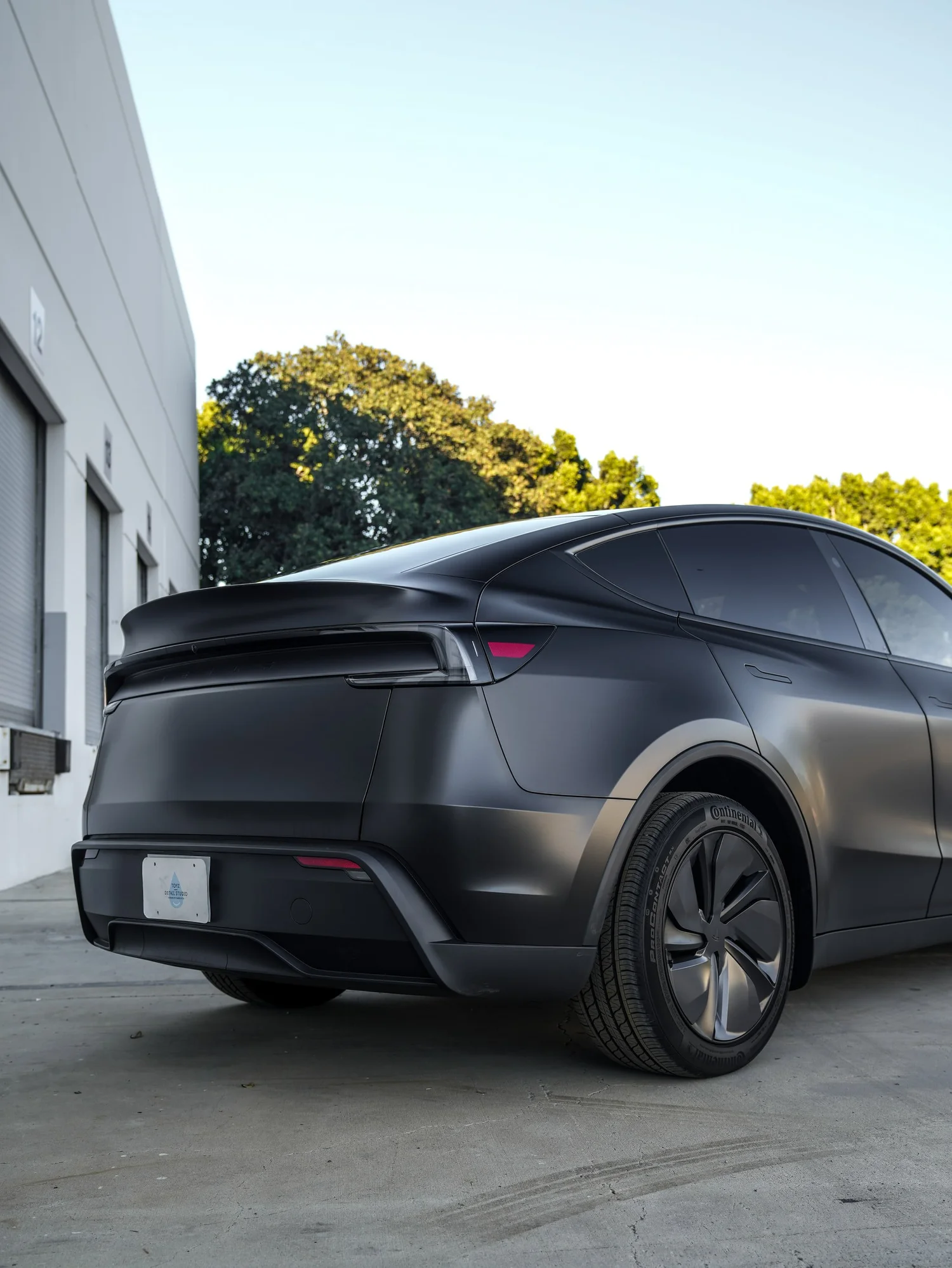Tesla Model Y 3M Satin Black after Vinyl Wrap, rear-right three-quarter view