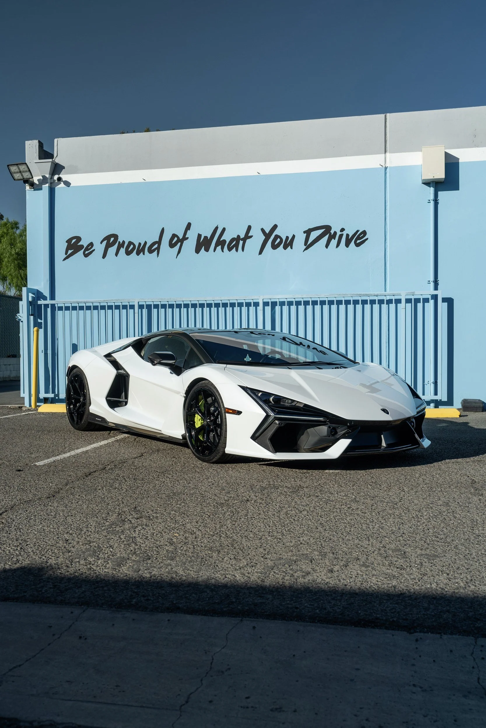 White Lamborghini Revuelto in a front three-quarter view outside Toyz Detail Studio.