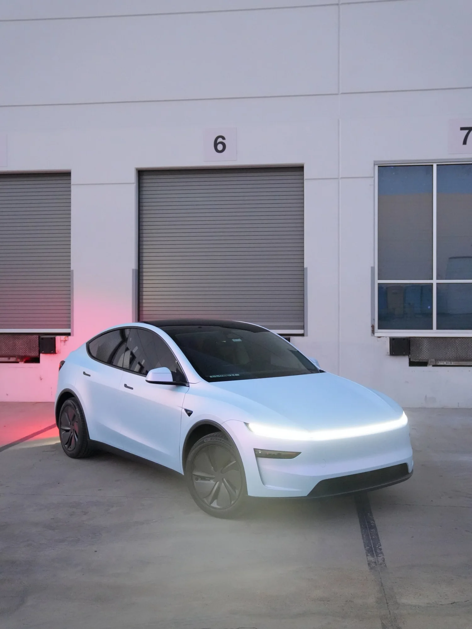 Tesla Model Y Color-Shifting White-to-Blue after Vinyl Wrap, alternate angle of front-left three-quarter view