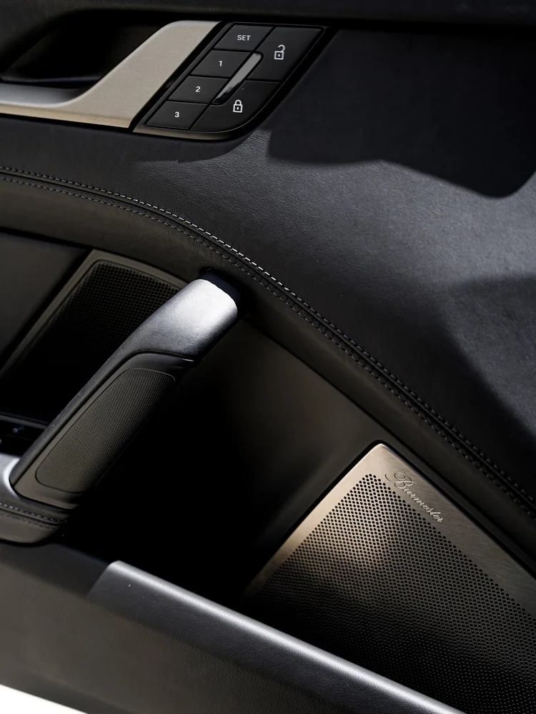 Turbo S interior door handle, seat-memory buttons and speaker grille.