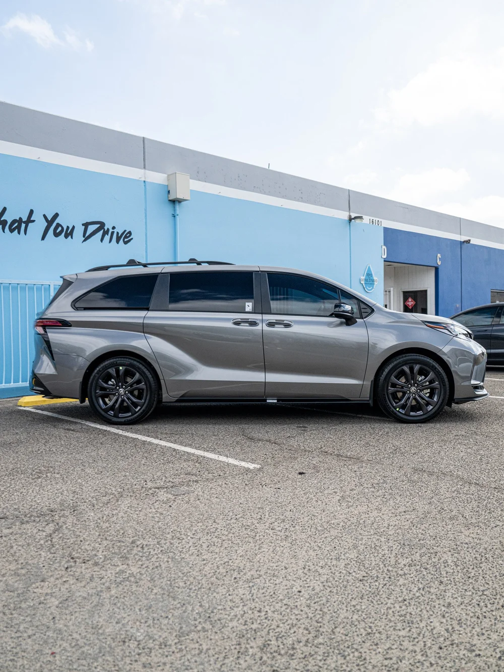 Full side profile of a Heavy Metal 2026 Toyota Sienna XSE with XPEL XR Plus tint