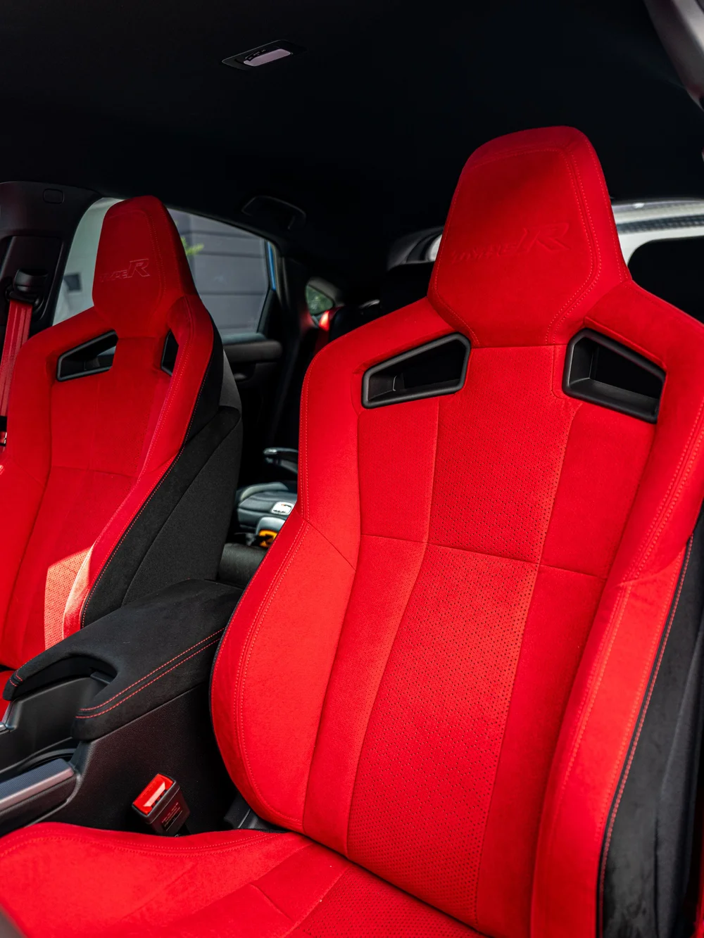 Red front sport seats inside a 2026 Honda Civic Type R