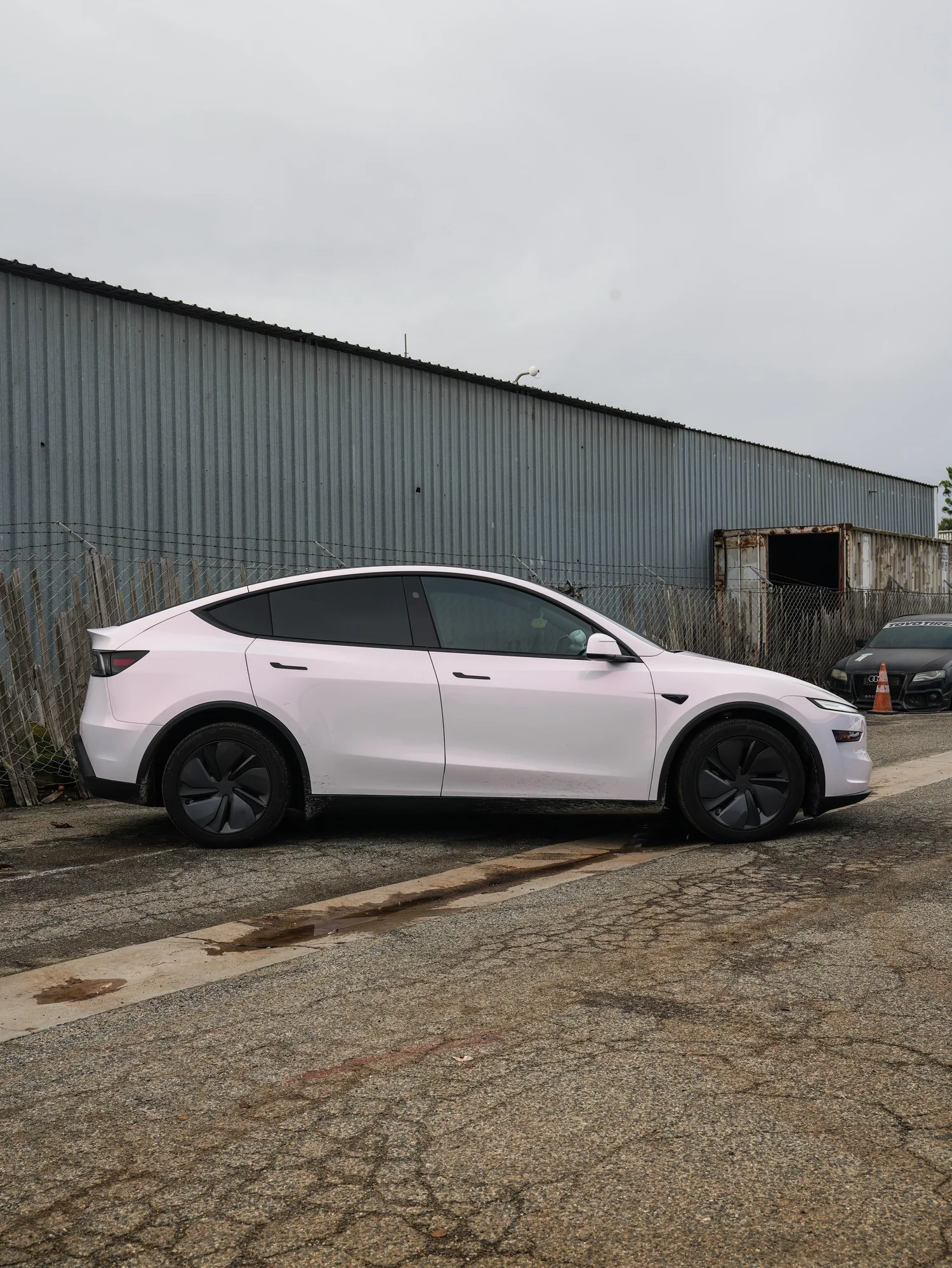 Pale Blush Pink Tesla Model Y after Vinyl Wrap, left-side profile