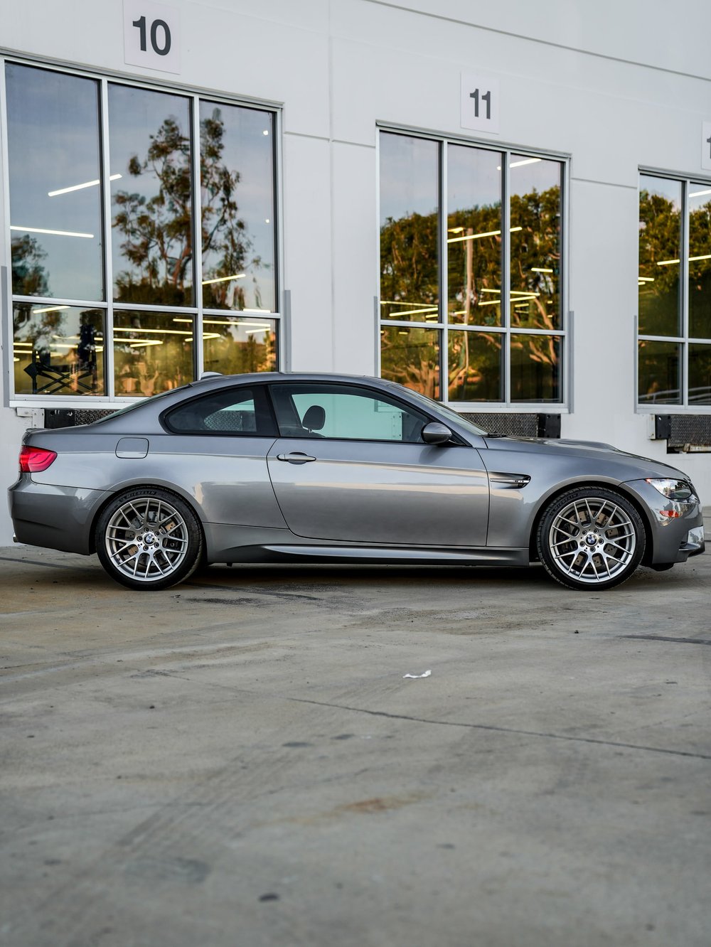 BMW E92 M3 paint protection film project, whole-car side profile outside the studio