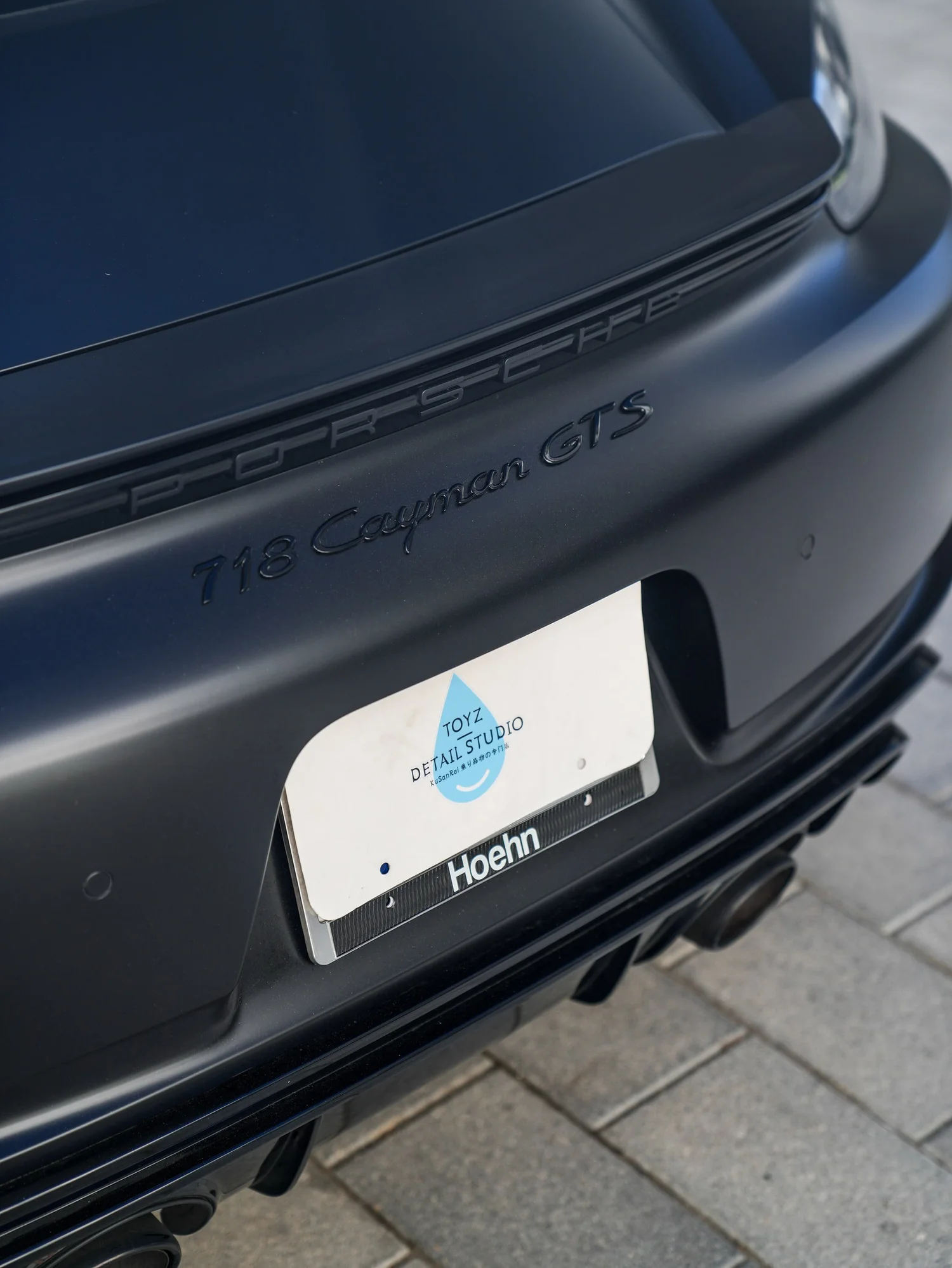 Porsche 718 Cayman GTS 3M Satin Black after Vinyl Wrap, rear diffuser and exhaust detail