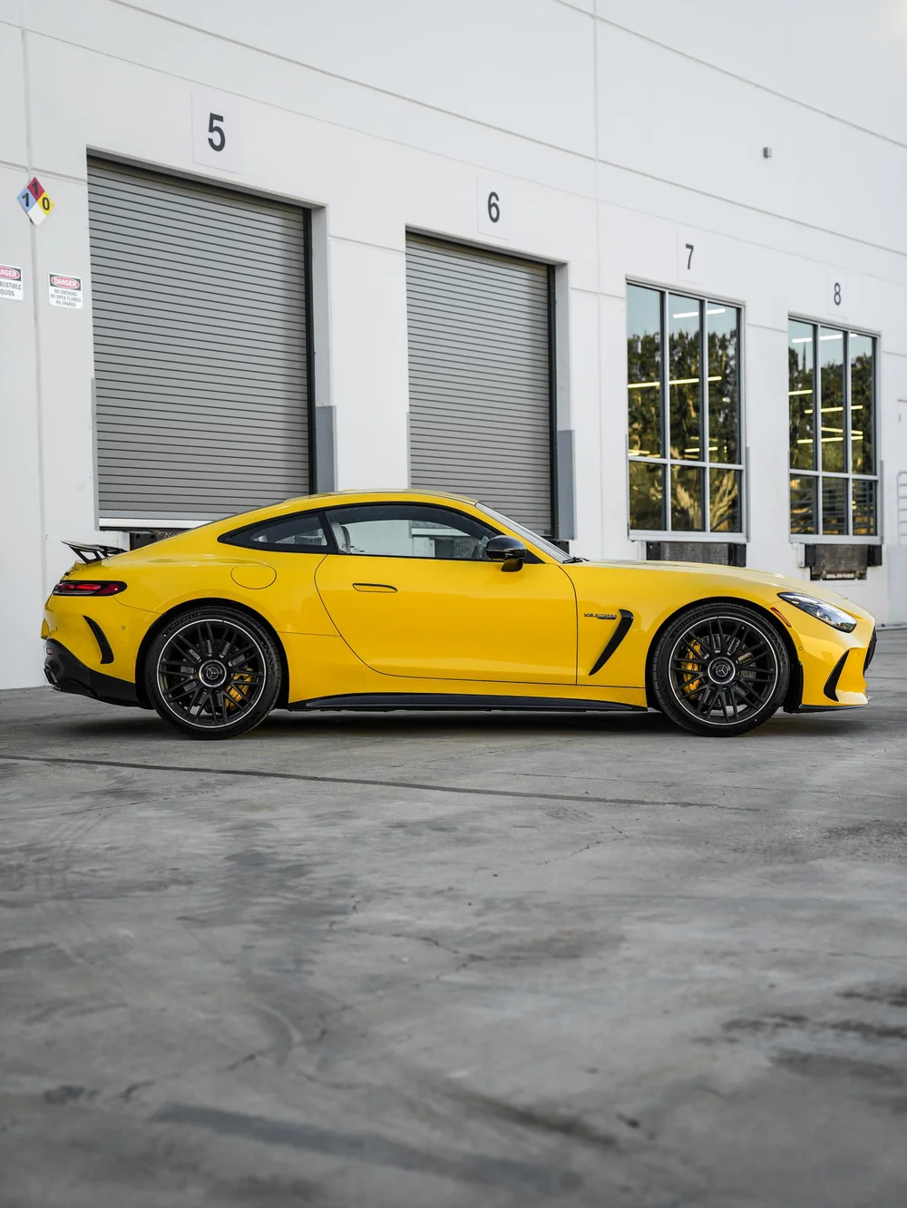 Yellow Mercedes-AMG GT 63, full side profile with black wheels