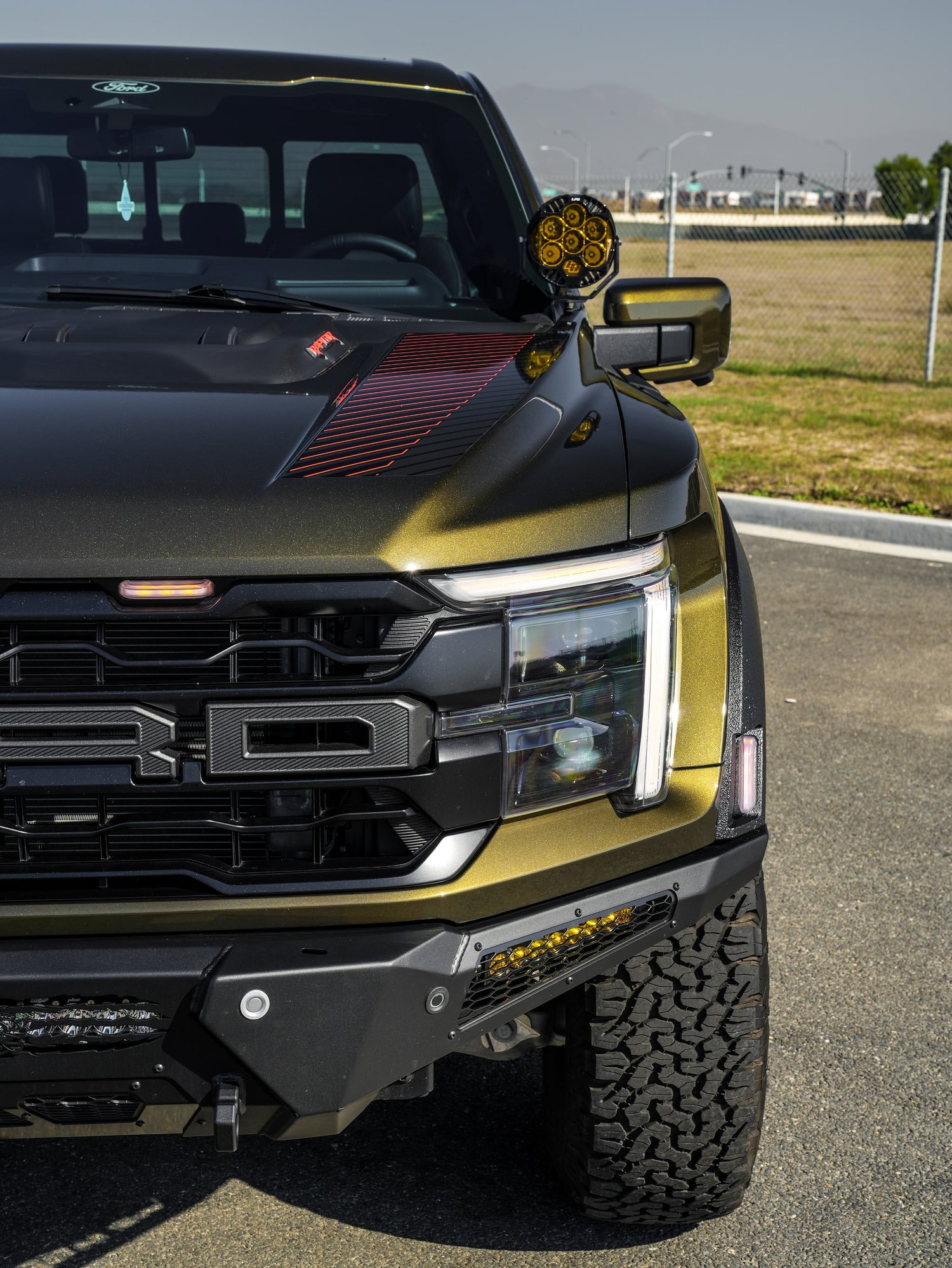 Black Ford F-150 Raptor after Paint Protection Film (PPF) and Window Tint, front-corner view