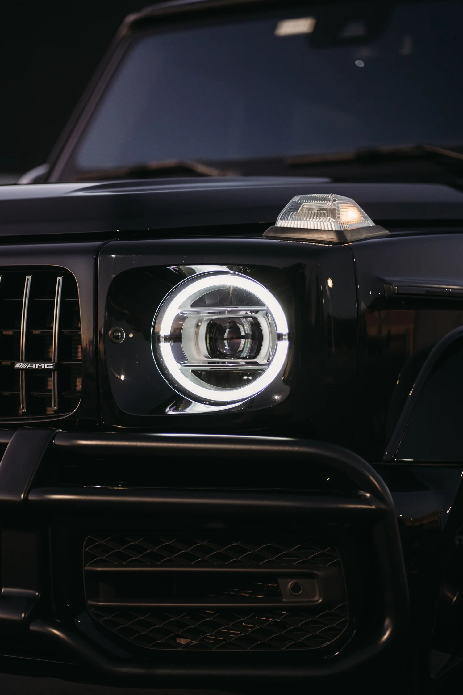 Mercedes-AMG G 63 after Paint Protection Film (PPF), Ceramic Coating, Chrome Delete and Wheel Powder Coating, front bumper and headlight detail