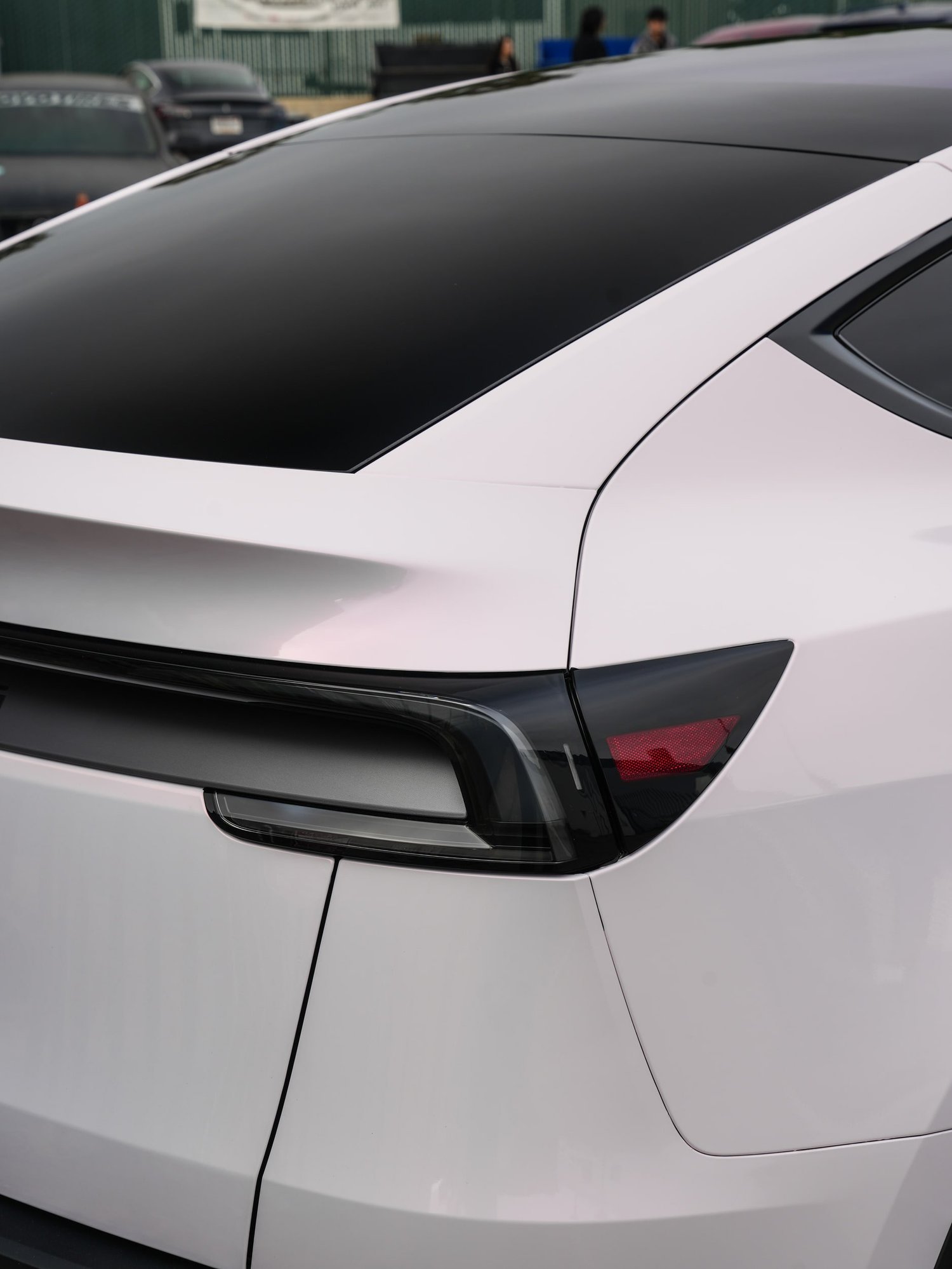 Pale Blush Pink Tesla Model Y after Vinyl Wrap, rear body and taillight view