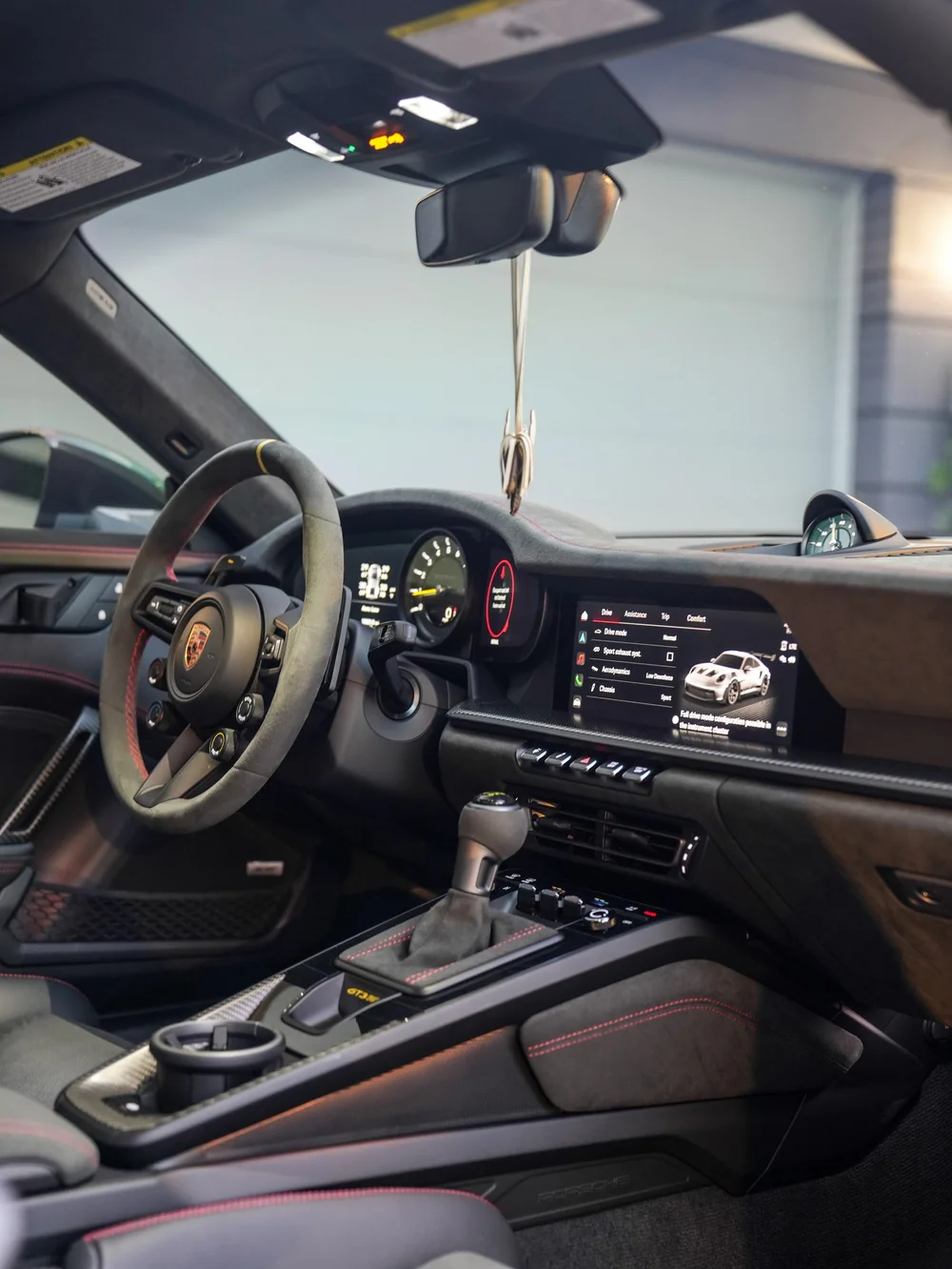 Cockpit, steering wheel and center console through the open door — Porsche 911 GT3 RS detailing project
