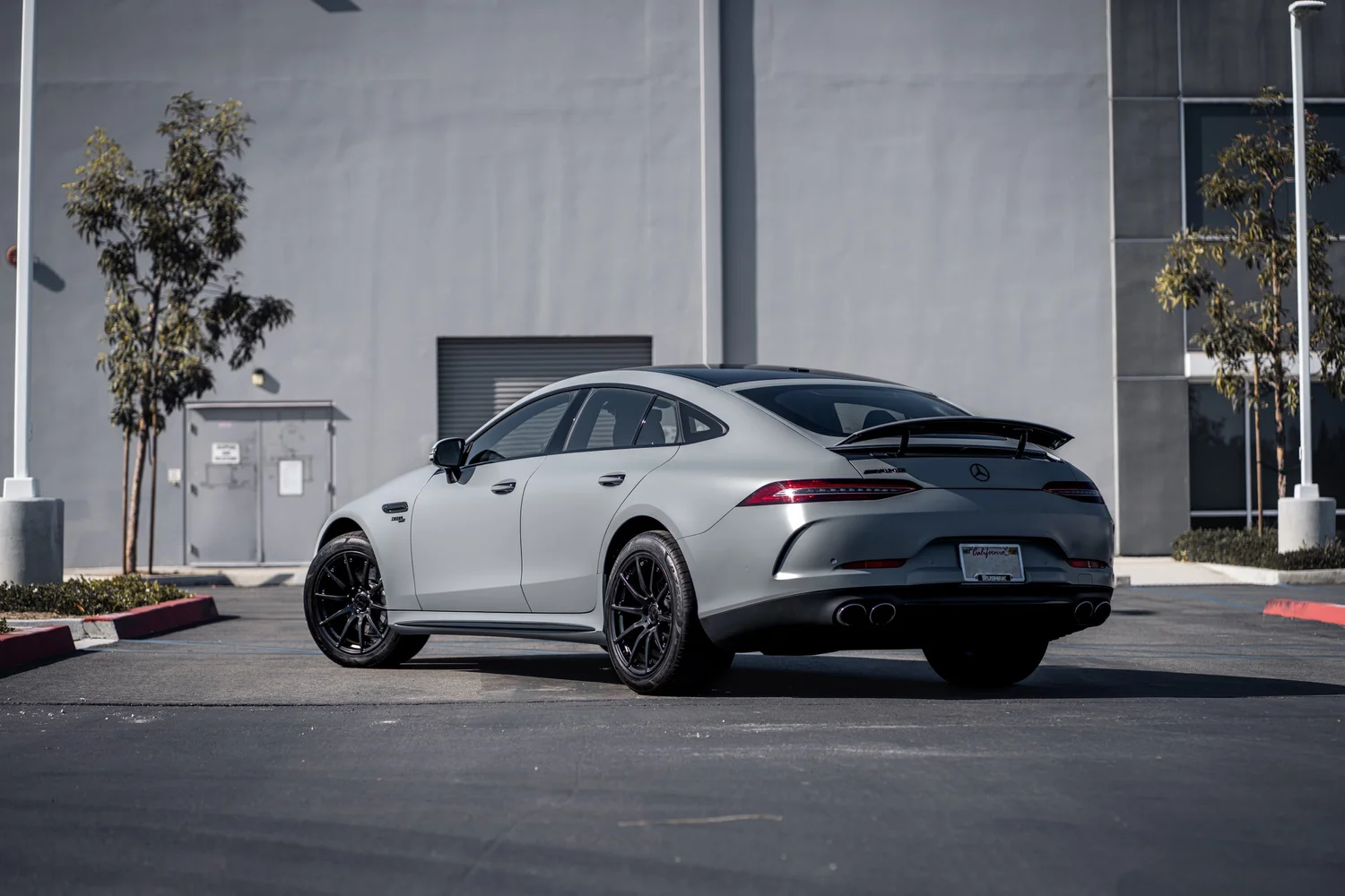 Mercedes-AMG GT 53 Avery Battleship Grey after Vinyl Wrap, rear-left three-quarter view