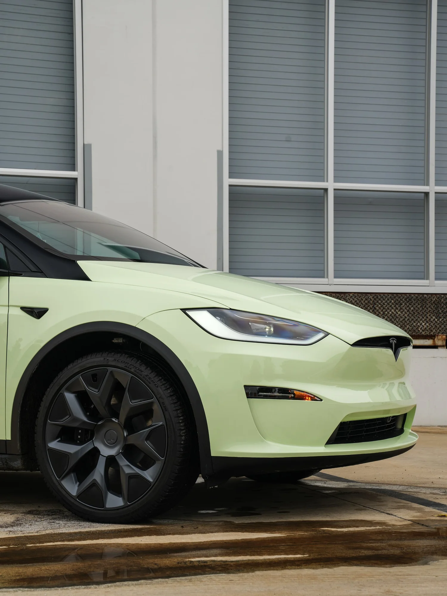 Tesla Model X Avocado Green after Vinyl Wrap, front wheel and body view