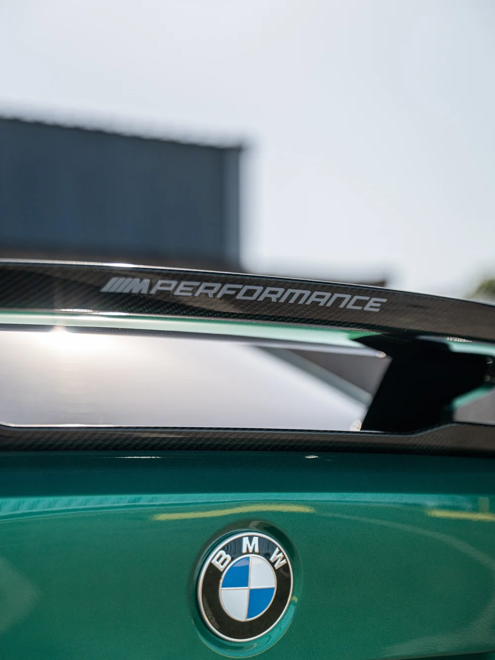 M Performance lettering on the carbon rear wing above the BMW trunk badge