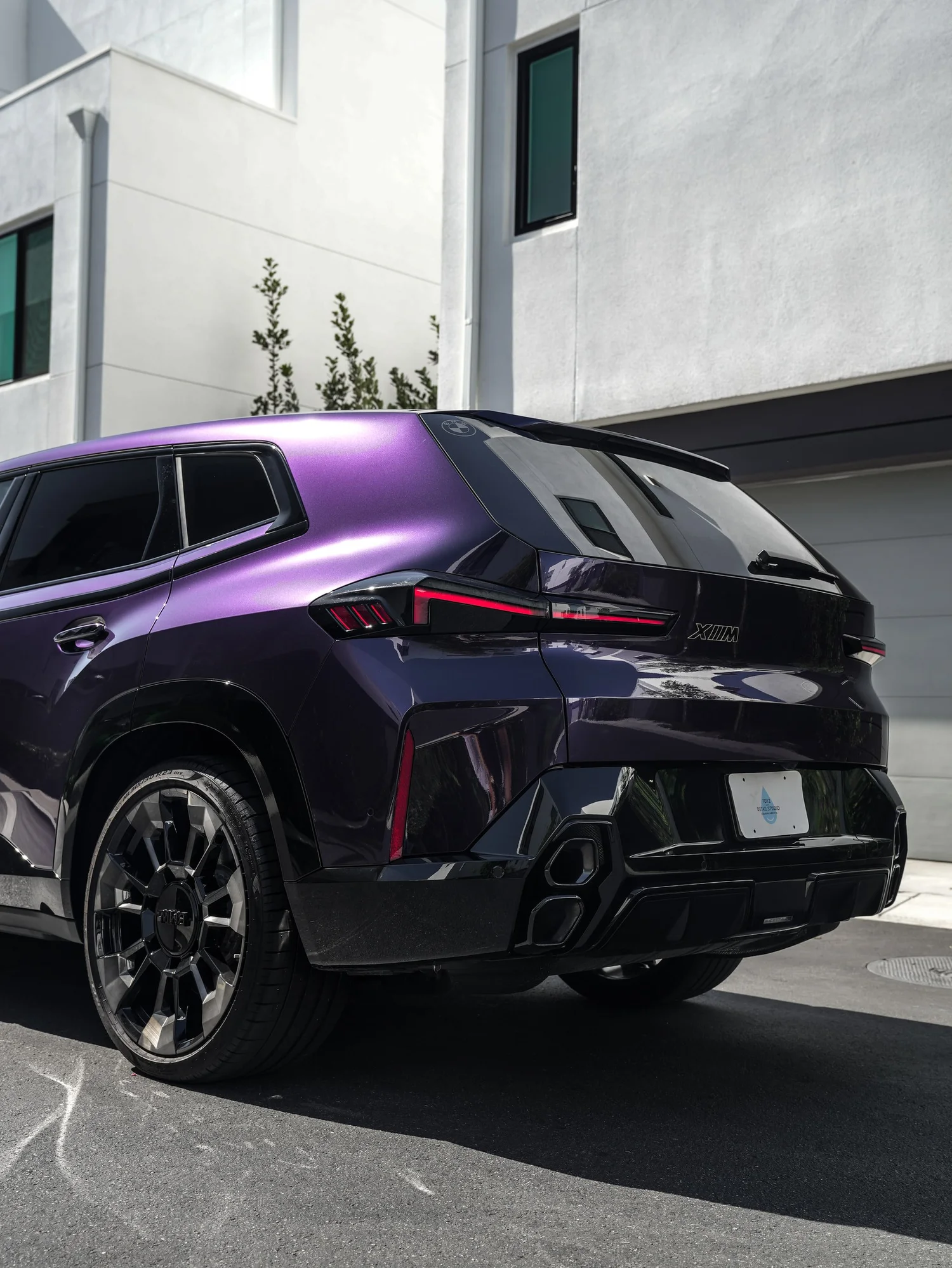 BMW XM Venetian Mauve Colored PPF after Paint Protection Film (PPF), low-angle rear view
