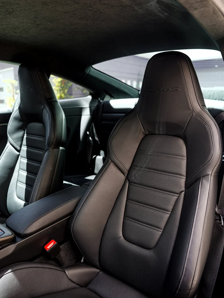 Black front seats and rear cabin inside the Porsche 911 Turbo S.
