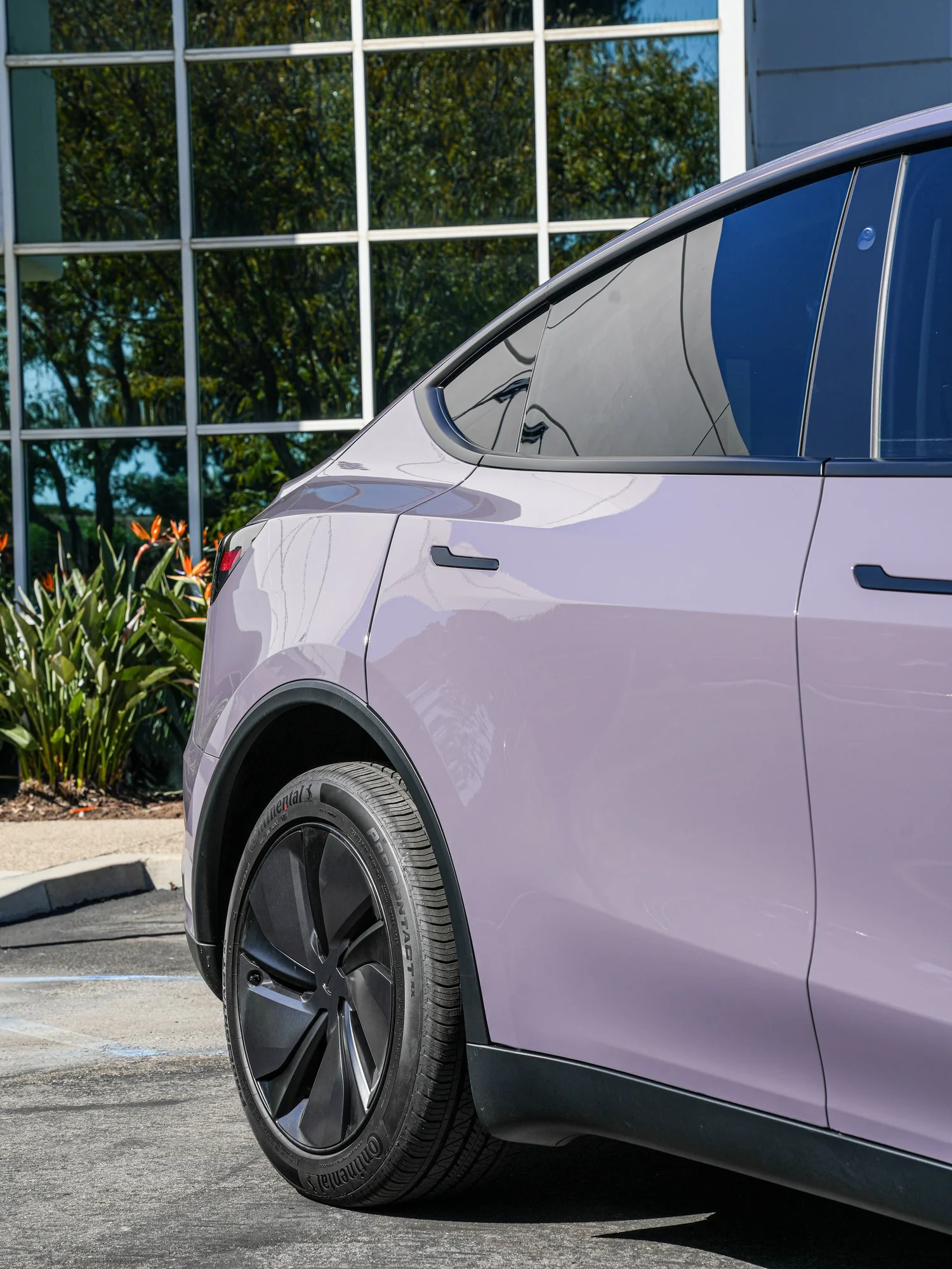 Tesla Model Y Provence Violet after Vinyl Wrap, rear-quarter and wheel view
