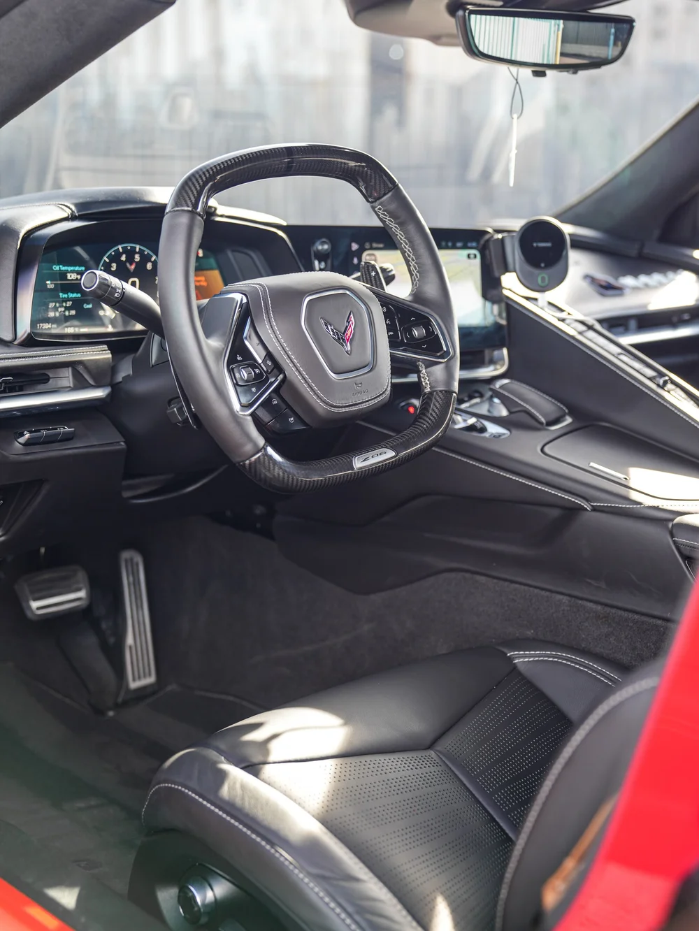Cockpit, steering wheel and driver seat through the open door — Chevrolet Corvette Z06 paint protection film project