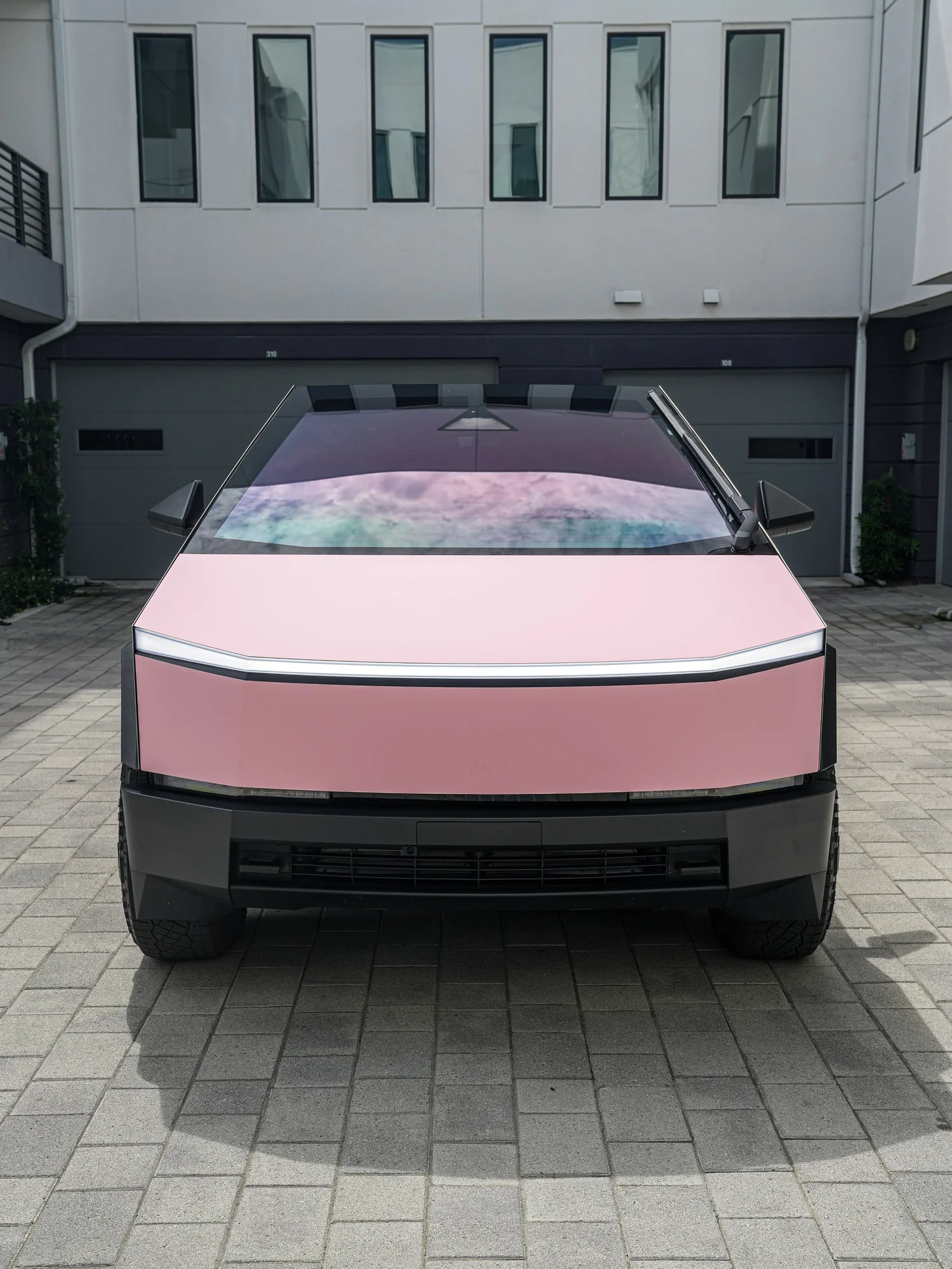 Satin Fresh Pink Tesla Cybertruck after Vinyl Wrap, direct front view