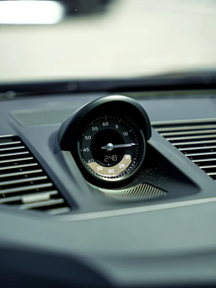 Dashboard clock and surrounding trim inside the Turbo S.