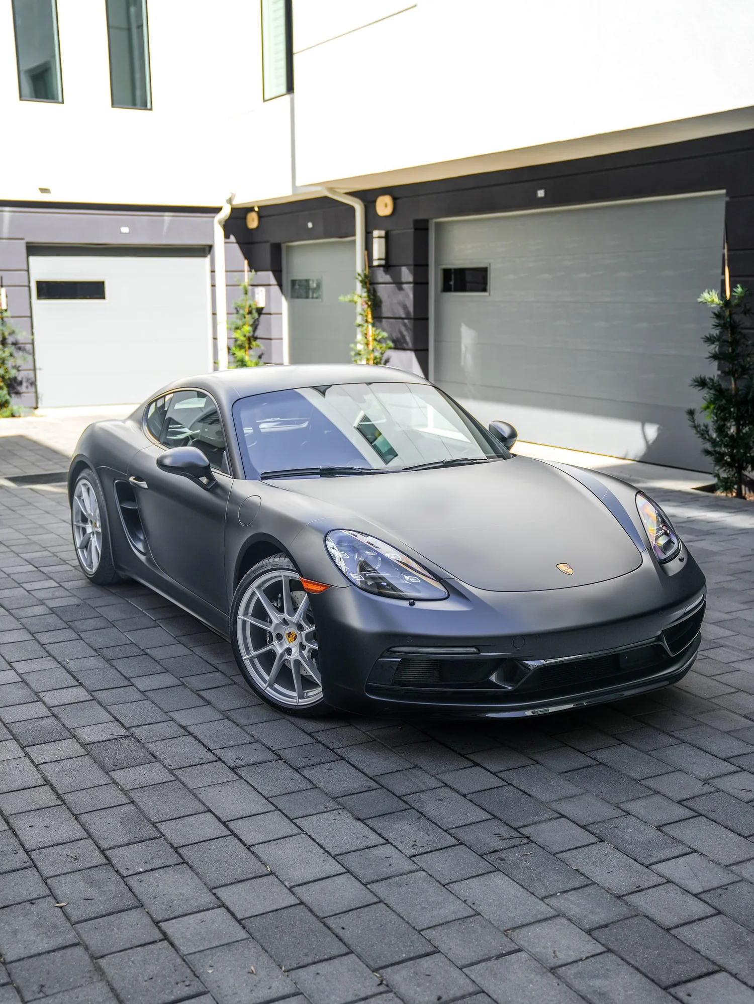 Porsche 718 Cayman GTS 3M Satin Black after Vinyl Wrap, front-right three-quarter view