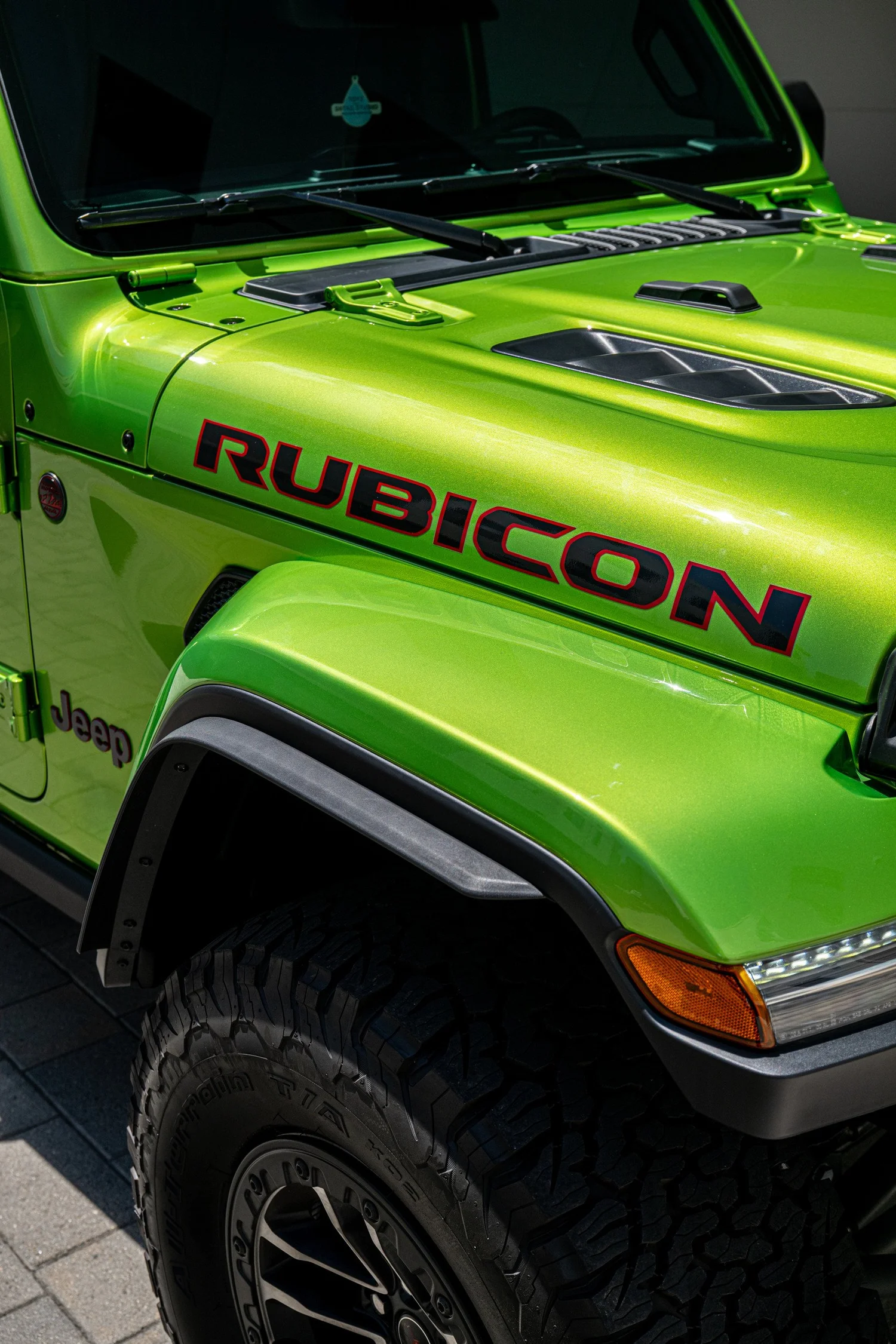 Gloss Mojito hood and fender with Rubicon lettering, hood hardware and the windshield above