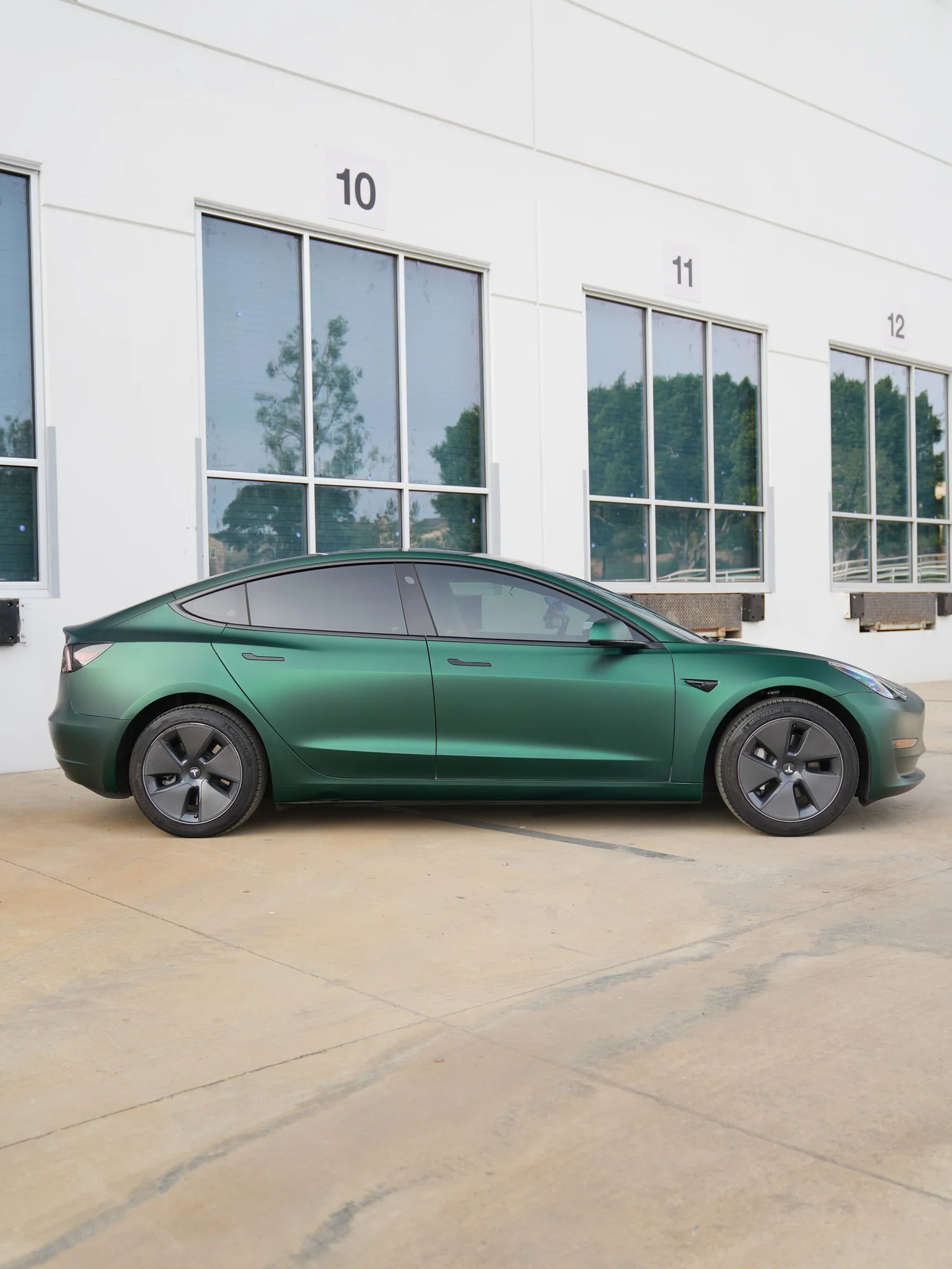 Tesla Model 3 Ghost Matte Green after Vinyl Wrap, left-side profile