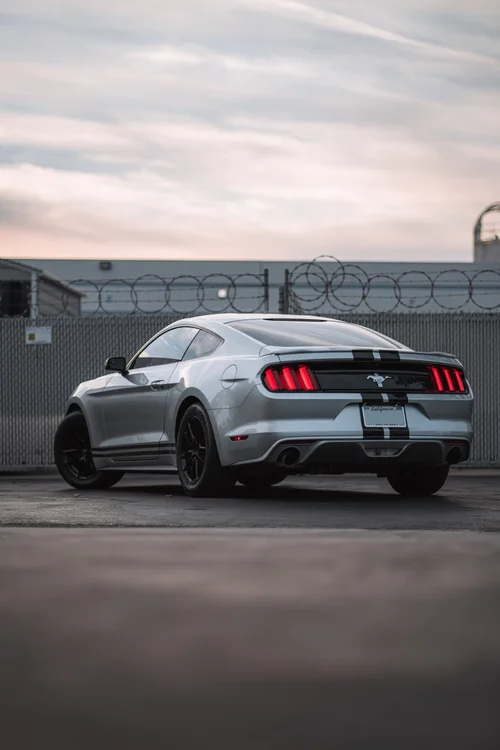 Ford Mustang rear three-quarter portrait showing its racing-stripe graphics