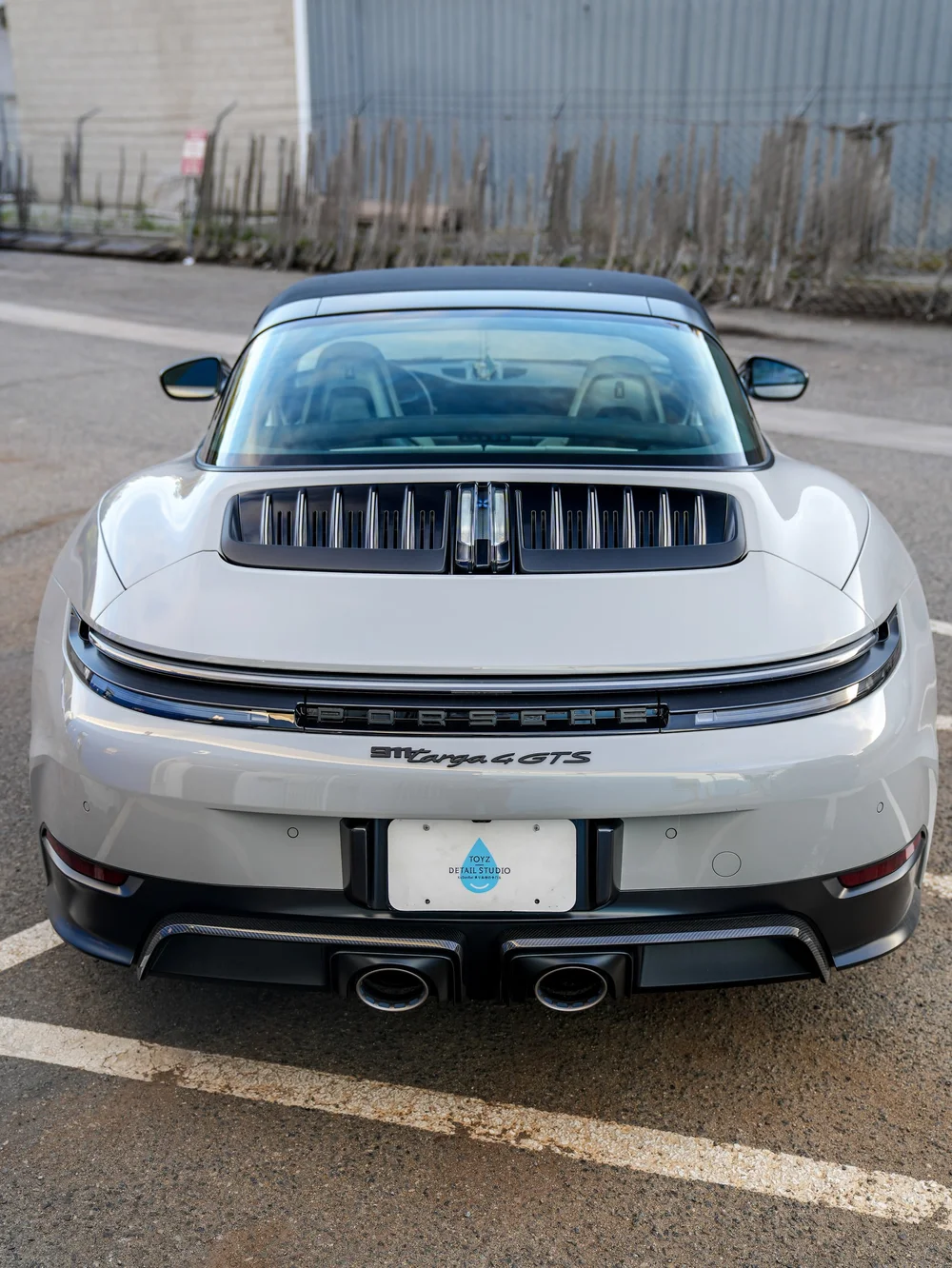 Complete straight rear view of the Porsche Targa on marked pavement