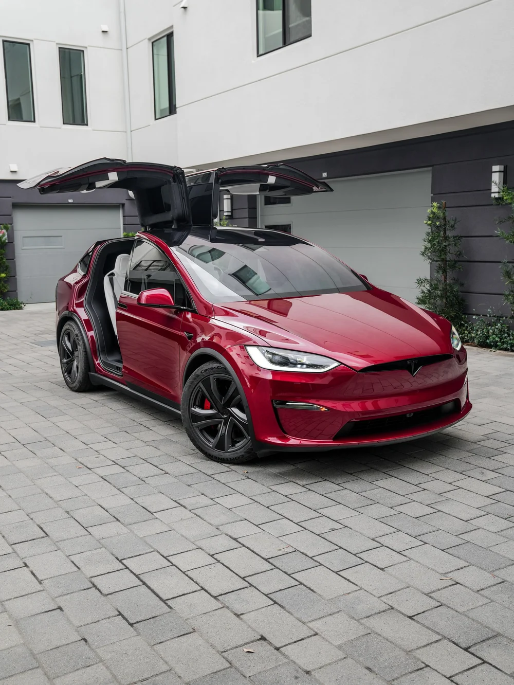 Tesla Model X PPF and XR Plus tint project, front three-quarter view with falcon-wing doors raised