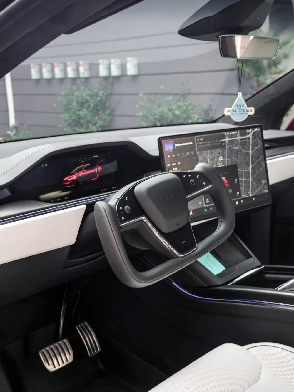 Tesla Model X PPF and XR Plus tint project, cabin view showing steering wheel and dashboard displays