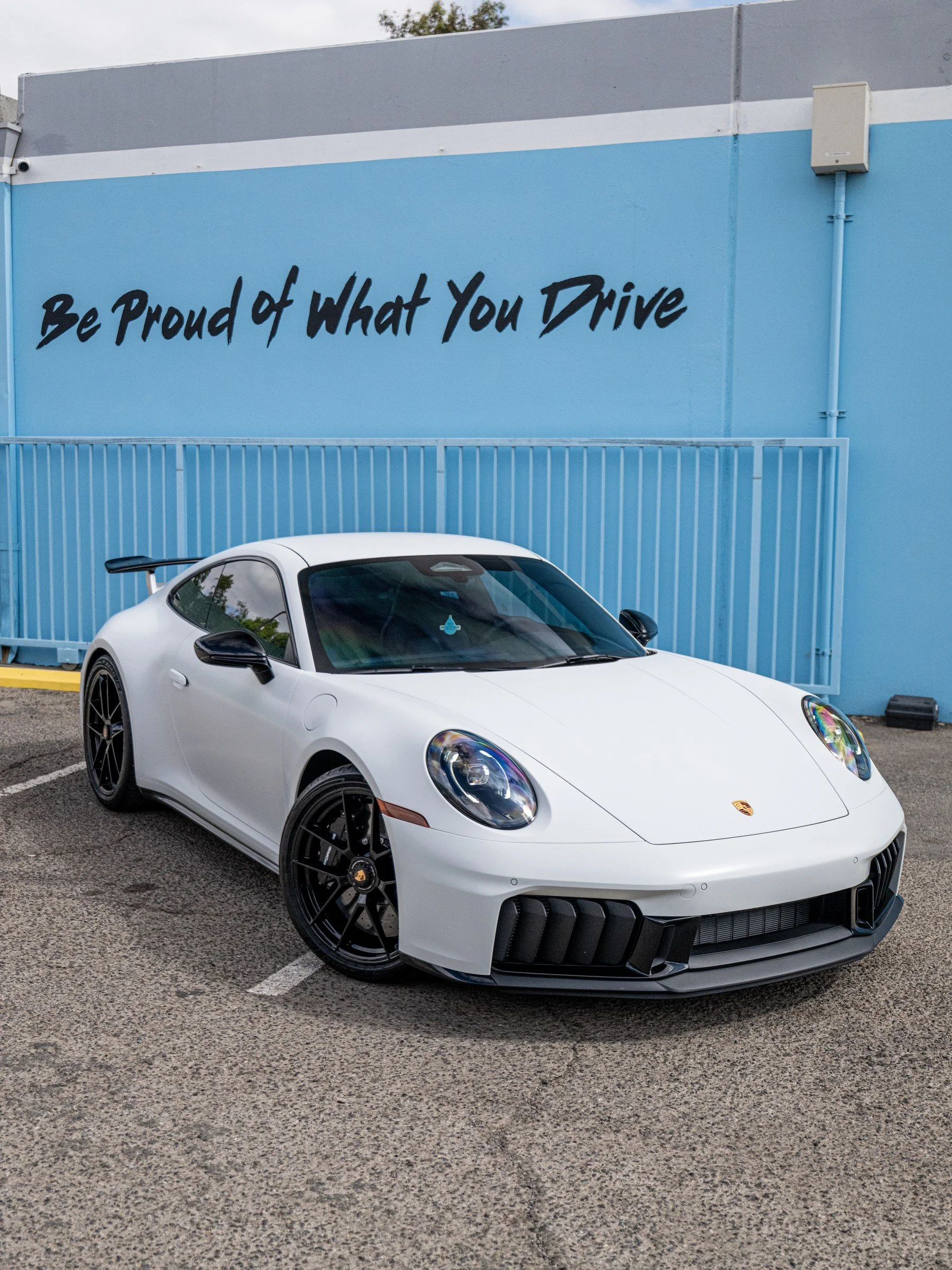 2026 Porsche 911 Carrera 4 GTS 992.2 in satin-white XPEL STEALTH PPF, front three-quarter view at Toyz Detail Studio