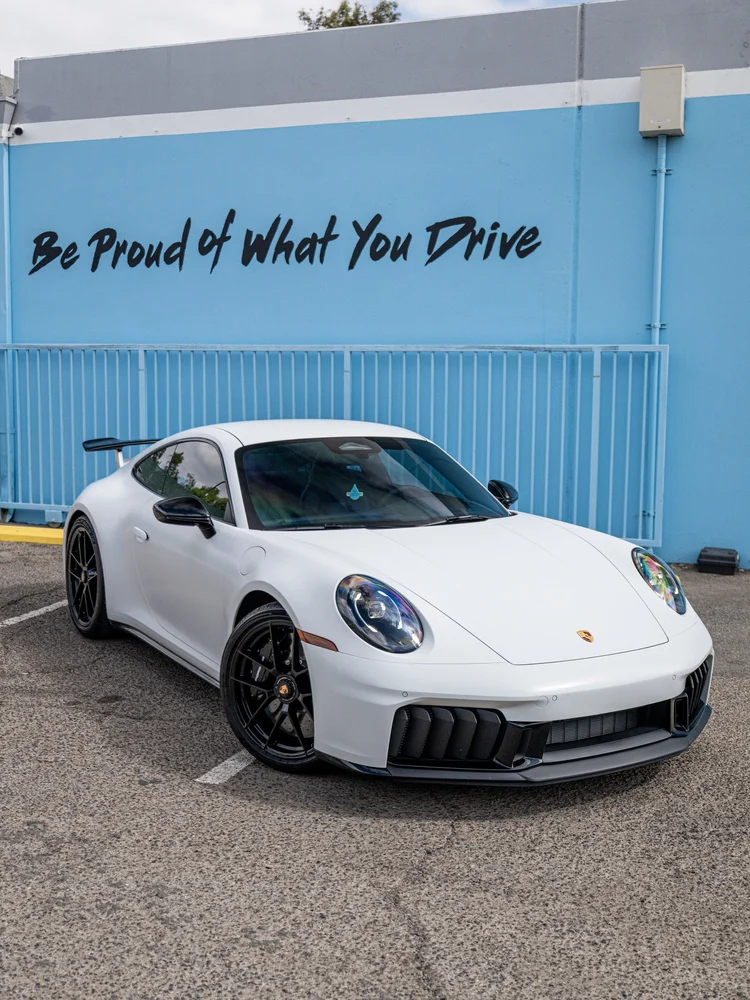 2026 Porsche 911 Carrera 4 GTS 992.2 in satin-white XPEL STEALTH PPF, front three-quarter view at Toyz Detail Studio