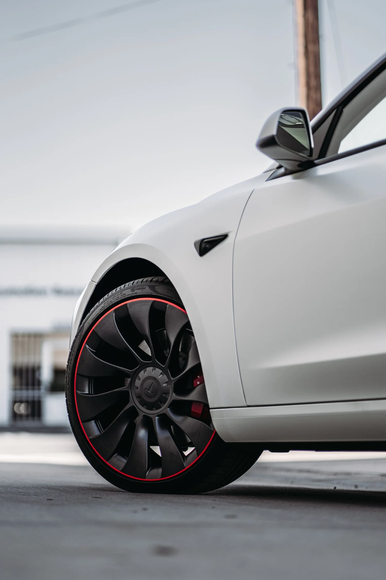 Tesla Model 3 3M 2080 Satin Pearl White after Vinyl Wrap, front-fender and wheel view