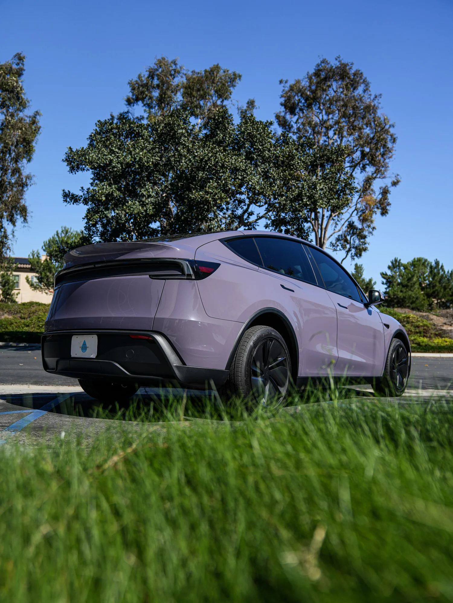 Tesla Model Y Provence Violet after Vinyl Wrap, rear-right three-quarter view