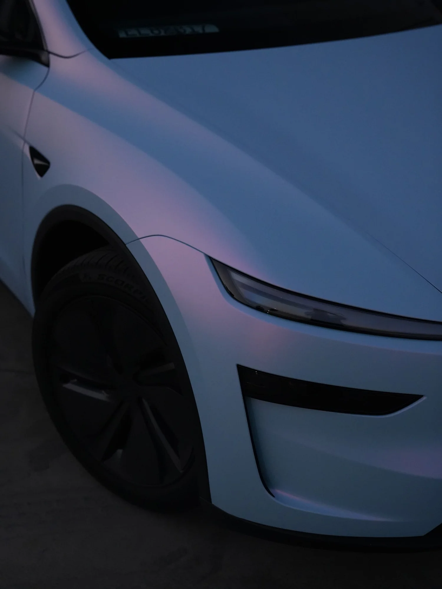 Tesla Model Y Color-Shifting White-to-Blue after Vinyl Wrap, front-corner view
